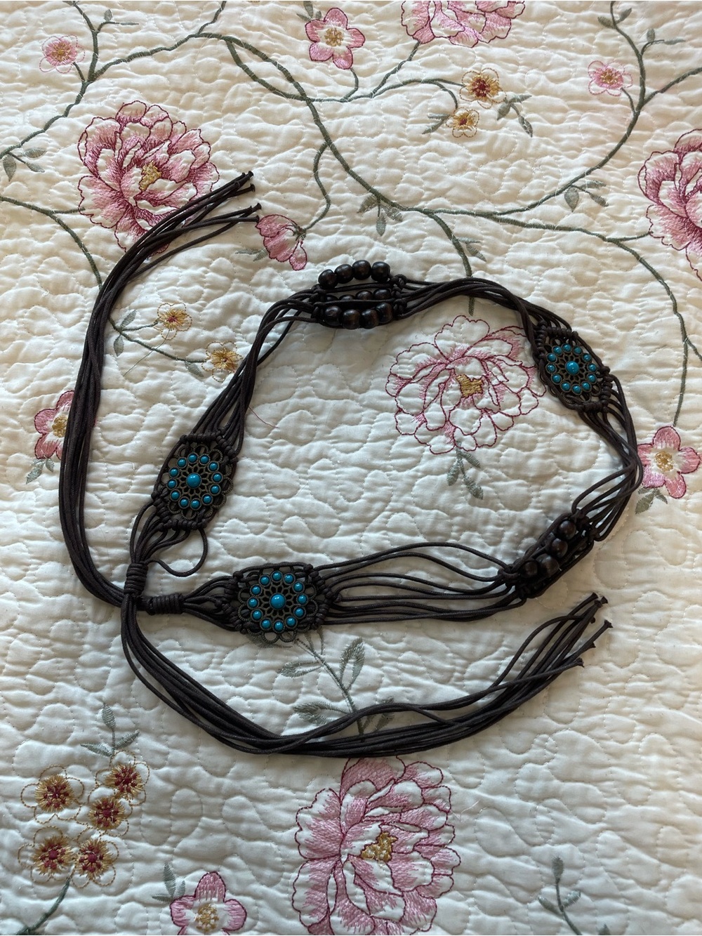 brown and teal woven belt